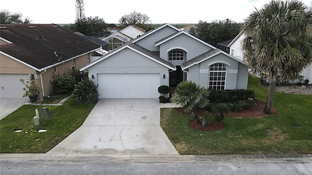 view of front facade featuring a garage and a front yard