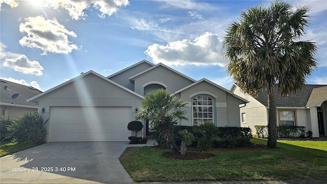 single story home featuring a garage and a front lawn