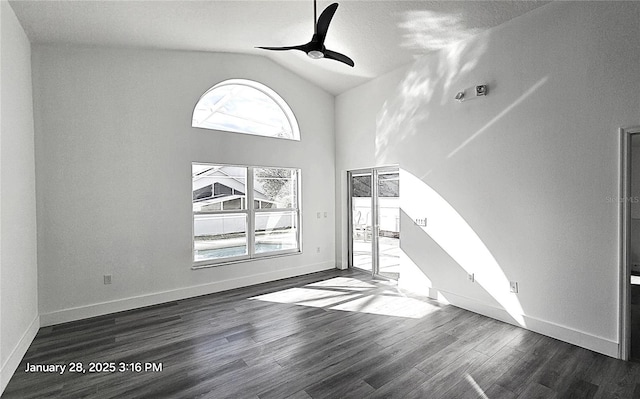 unfurnished living room with dark wood-type flooring, ceiling fan, high vaulted ceiling, and a textured ceiling