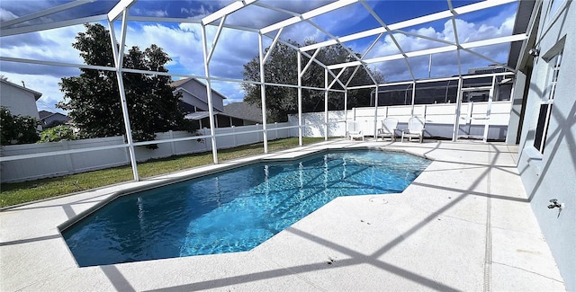 view of pool with a lanai and a patio area