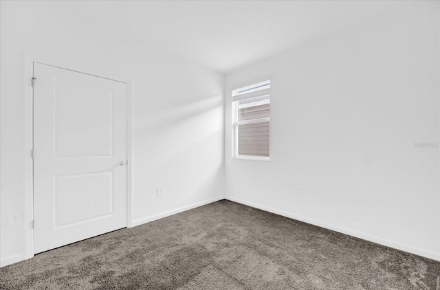 unfurnished room with carpet flooring