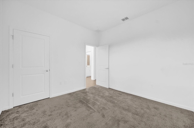 unfurnished bedroom featuring carpet flooring