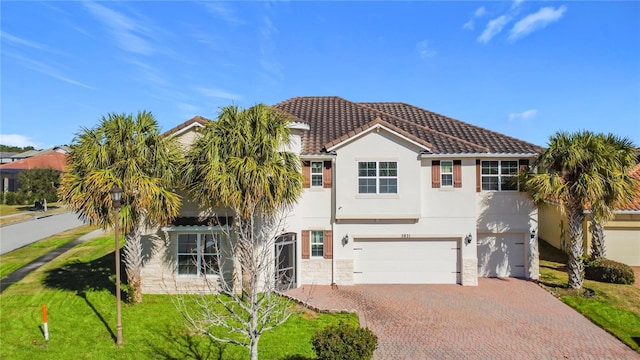 view of front of house featuring a garage and a front yard