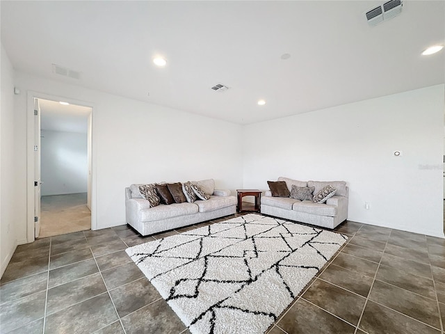 living room with dark tile patterned floors