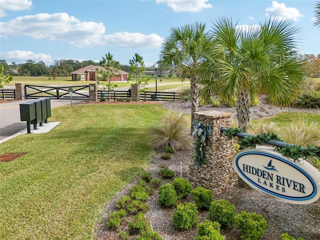 view of property's community with a yard