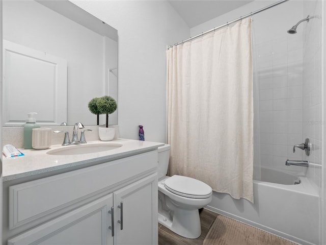 full bathroom featuring vanity, hardwood / wood-style flooring, toilet, and shower / tub combo with curtain