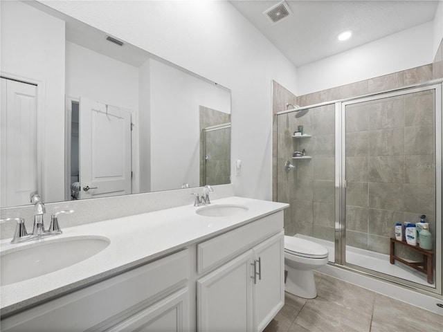 bathroom with vanity, toilet, and walk in shower