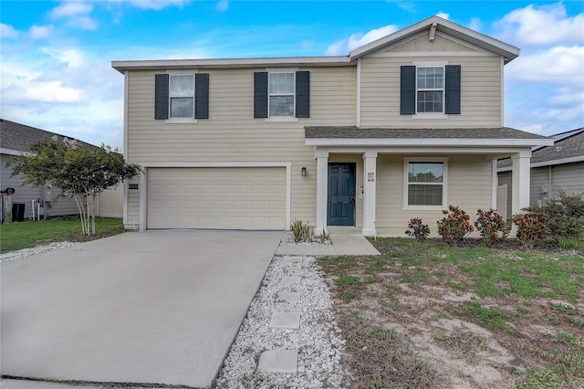 front of property with a garage and a porch