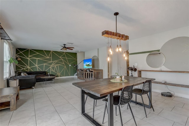 tiled dining area featuring ceiling fan