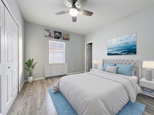 bedroom featuring wood-type flooring and ceiling fan