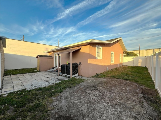 back of property featuring a patio