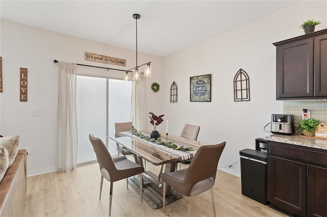 dining room featuring light wood-type flooring