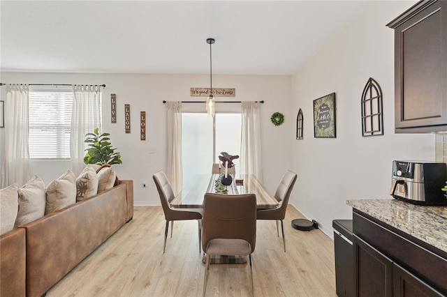 dining room with light wood-type flooring