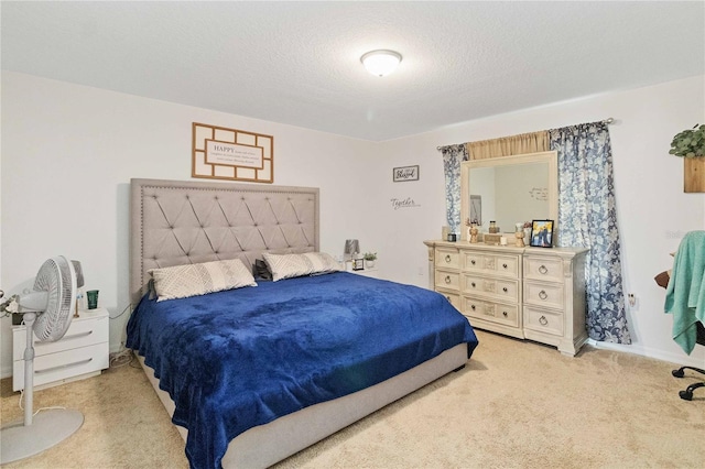 bedroom featuring carpet floors and a textured ceiling