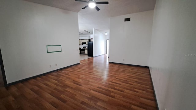 unfurnished room featuring dark hardwood / wood-style floors and ceiling fan