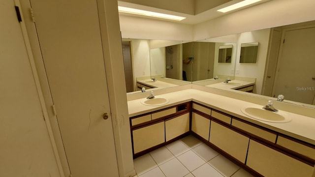 bathroom featuring tile patterned flooring and vanity