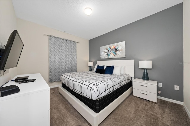 bedroom featuring dark colored carpet