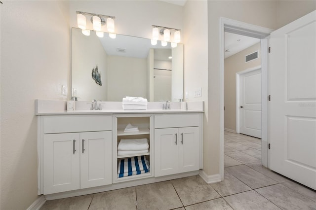 bathroom featuring tile patterned floors and vanity