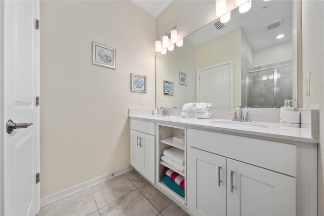 bathroom with vanity, tile patterned floors, and a shower with shower door