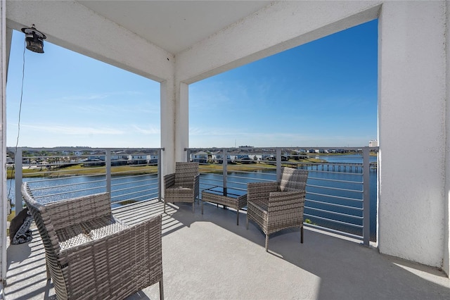 balcony featuring a water view