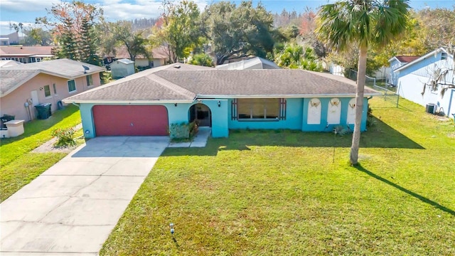 ranch-style house with a garage and a front yard