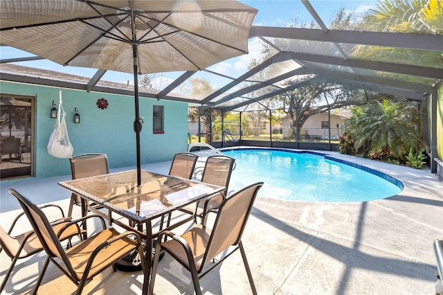 view of swimming pool with a lanai and a patio area