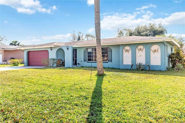 single story home with a garage and a front lawn