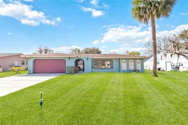 ranch-style house with a garage and a front lawn