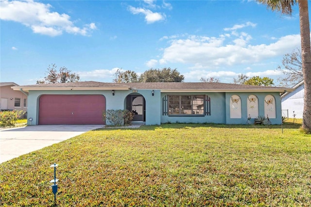 single story home with a garage and a front lawn