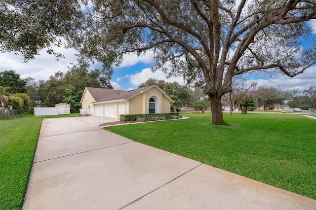 single story home with a garage and a front yard