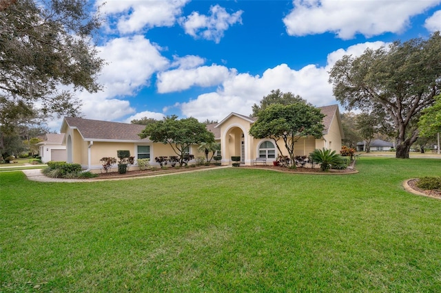 view of front facade featuring a garage and a front lawn