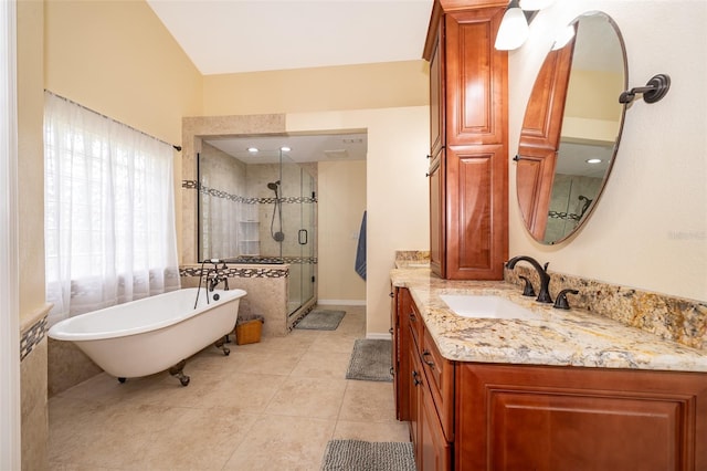 bathroom featuring vanity, independent shower and bath, and tile patterned flooring