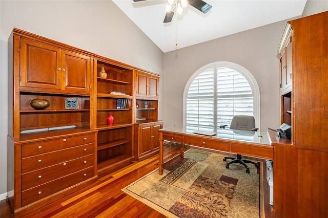 office with vaulted ceiling, ceiling fan, and dark hardwood / wood-style flooring