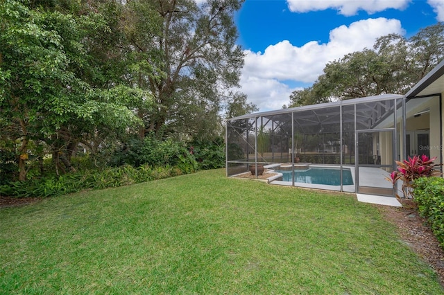 view of yard with glass enclosure