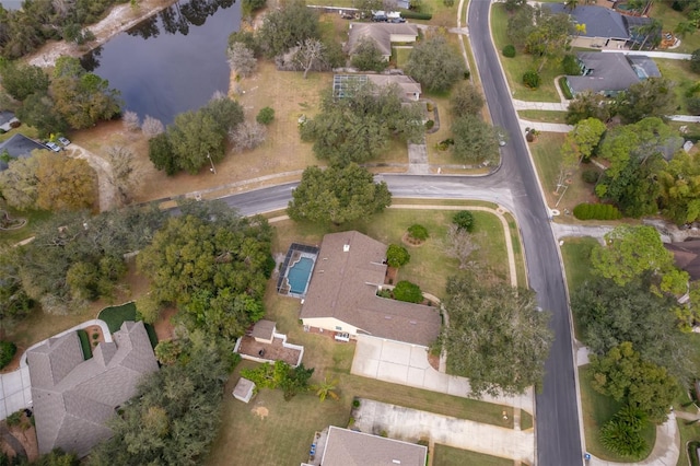 birds eye view of property with a water view