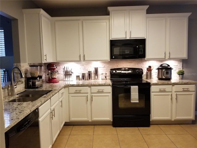 kitchen featuring white cabinetry, backsplash, sink, and black appliances