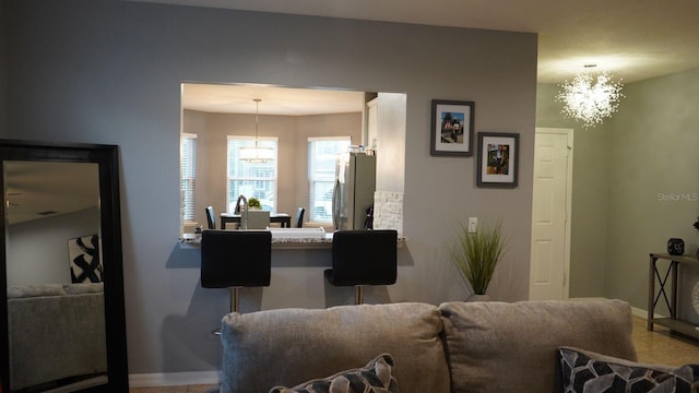 living room featuring an inviting chandelier