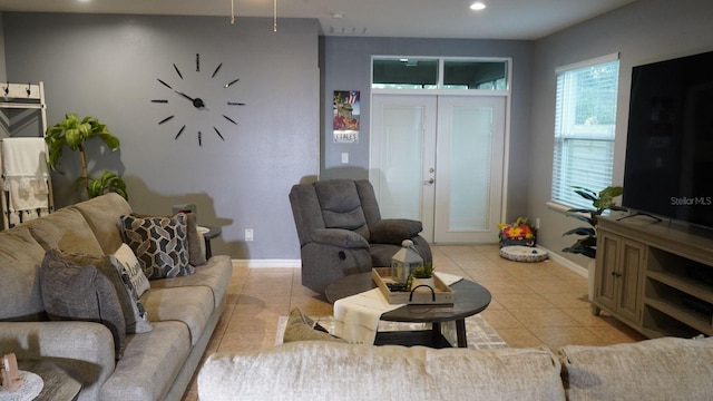 tiled living room featuring french doors