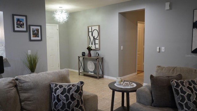 tiled living room with a chandelier