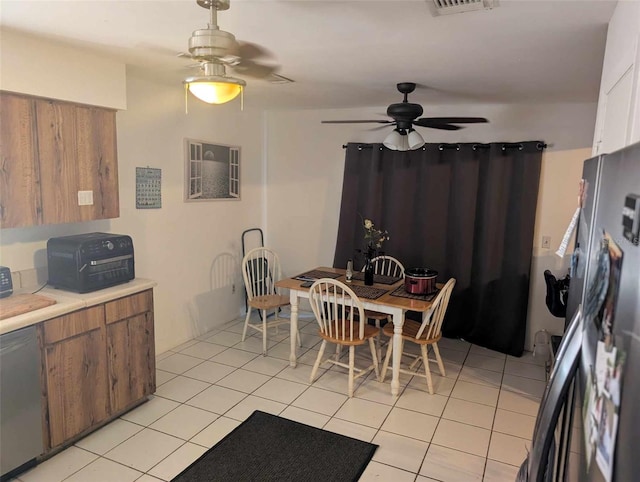 interior space with ceiling fan, appliances with stainless steel finishes, and light tile patterned floors