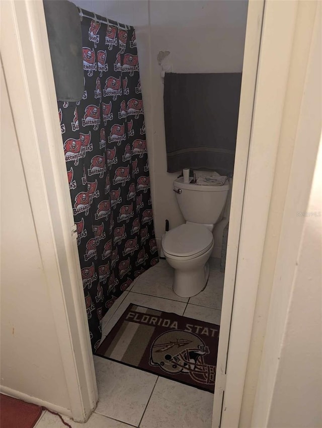 bathroom featuring tile patterned floors and toilet