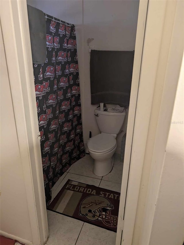 bathroom featuring tile patterned floors and toilet