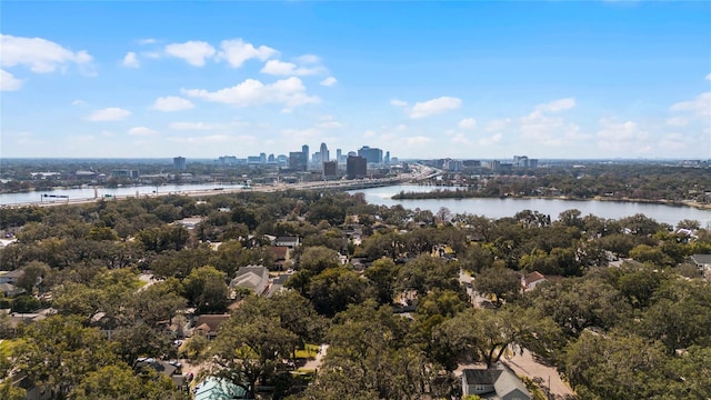 birds eye view of property featuring a water view and a city view