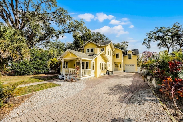 view of front of property with a garage and a porch