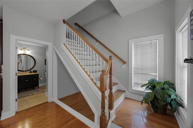 stairway with wood finished floors