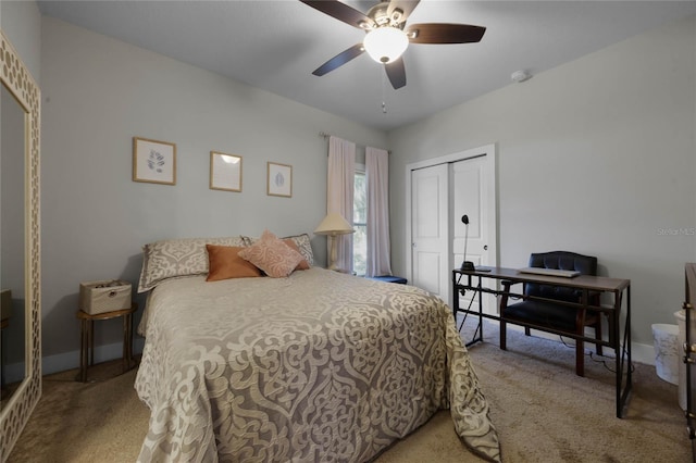 bedroom with ceiling fan, carpet floors, a closet, and baseboards