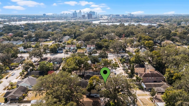 birds eye view of property with a view of city and a water view