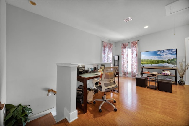 office area with attic access, visible vents, light wood-style flooring, and recessed lighting