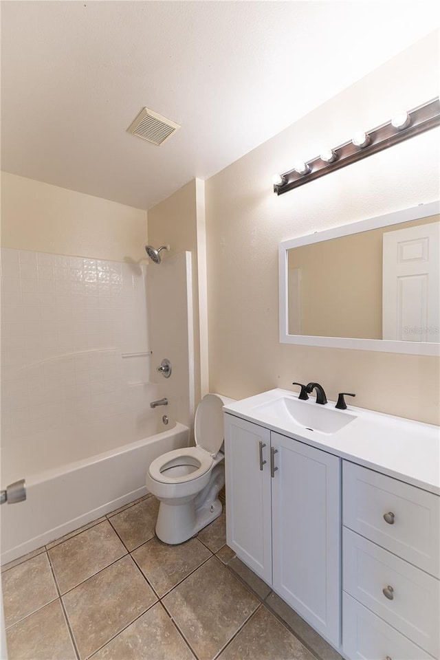 full bathroom featuring tile patterned floors, vanity, toilet, and bathing tub / shower combination