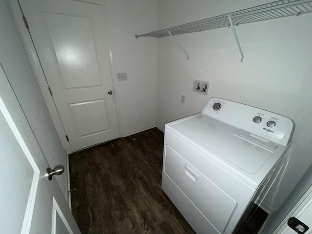 laundry area featuring dark wood-type flooring and washer / dryer